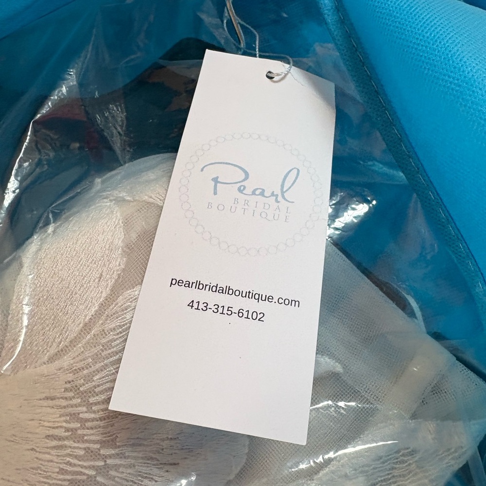 Stella York new with tags, never worn. Size 12. Chic Strapless Ivory Gown - Picture 12 of 12